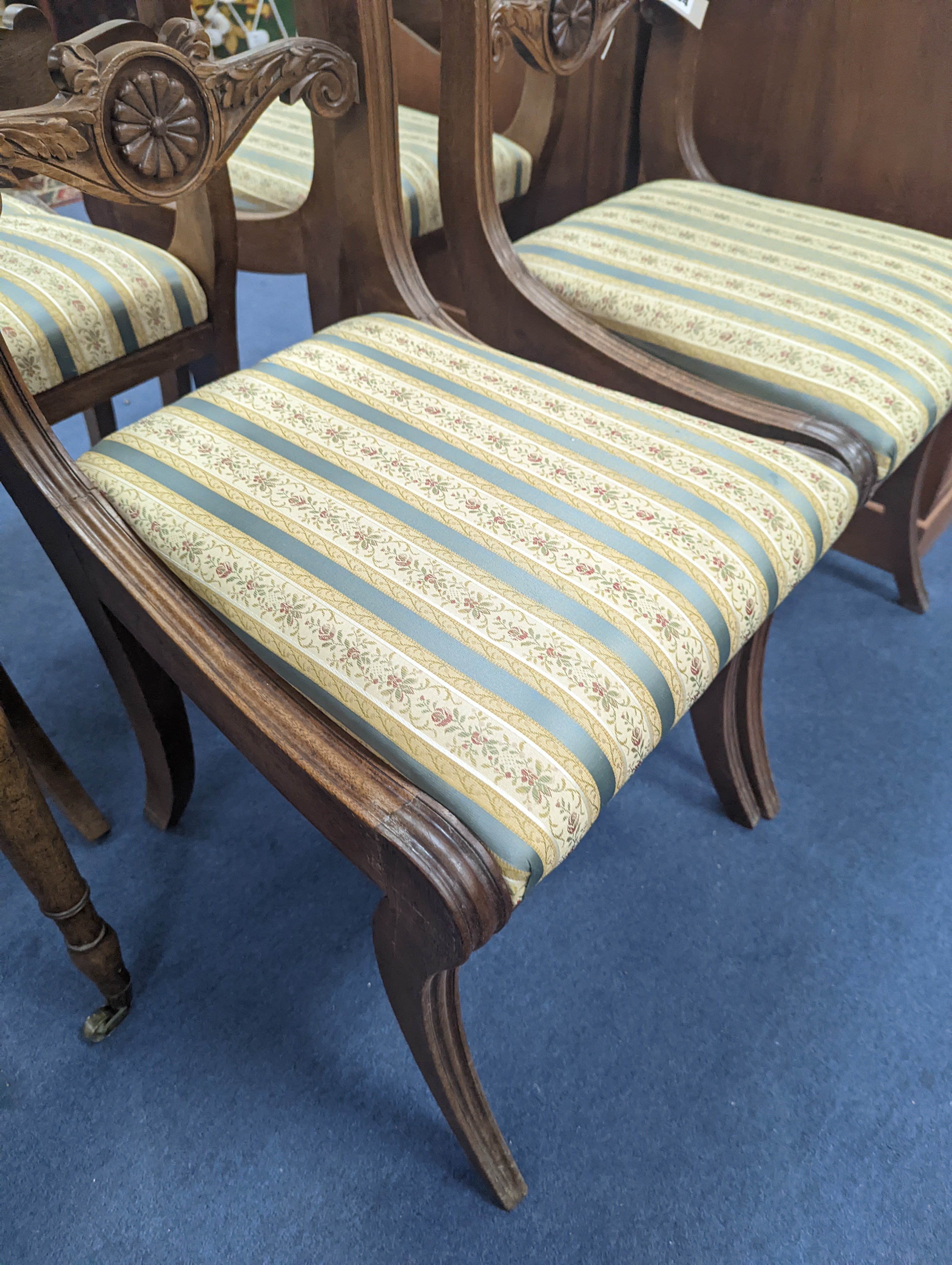 A set of six Regency mahogany dining chairs on sabre legs